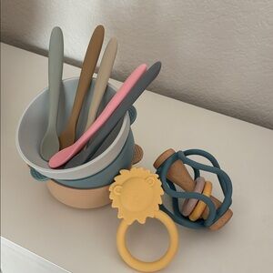 Baby Silicone Eating Utensils + Mushie Lion Teether and Target Wooden Shaker